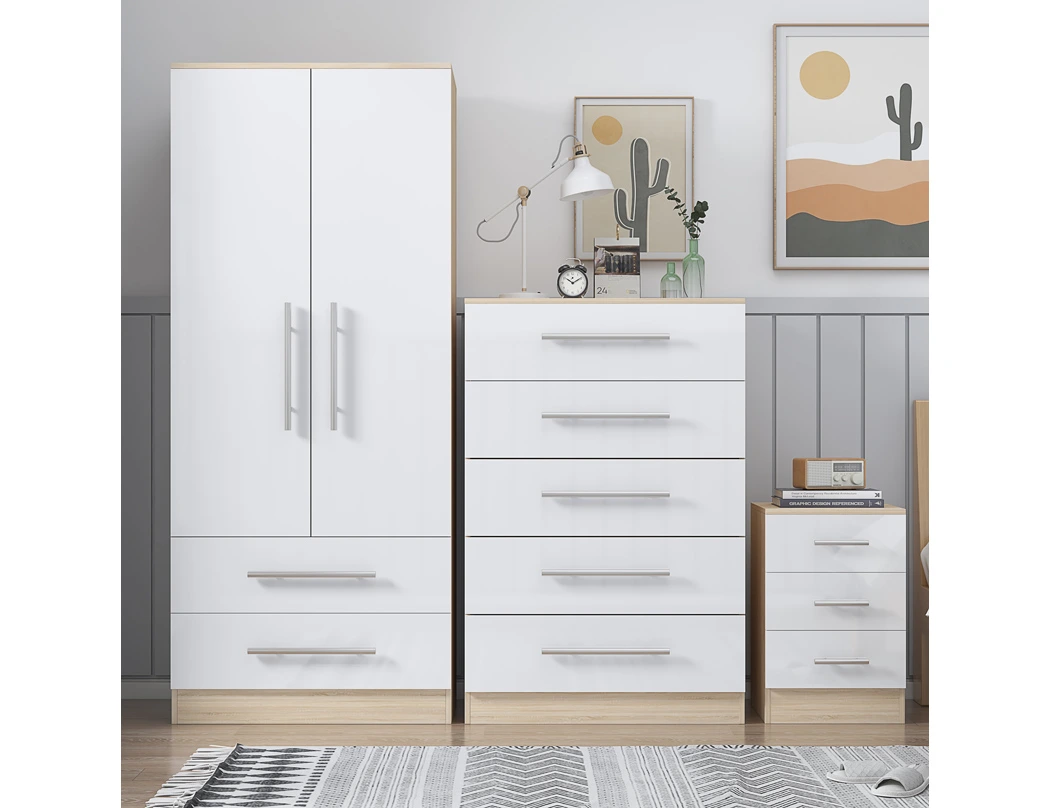 White bedroom furniture trio set featuring a two door wardrobe, chest of drawers and bedside cabinet with oak effect trim